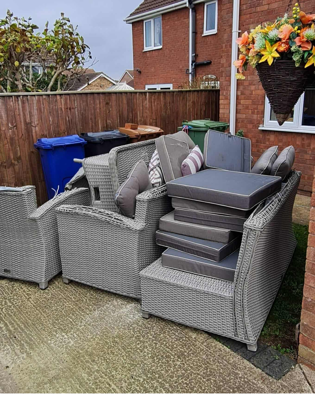 Patio furniture piled outside a house